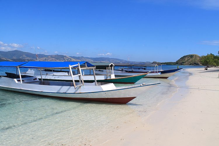 Boats on the beach after snorkelling in the 17 Islands Marine Park in Riung, Flores, Indonesia