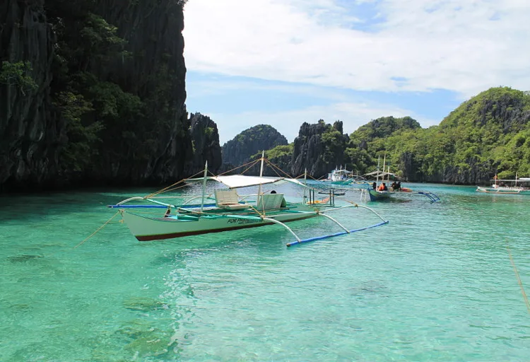 Snorkeling in a small lagoon in the Bacuit archipelago, El Nido, Palawan, The Philippines