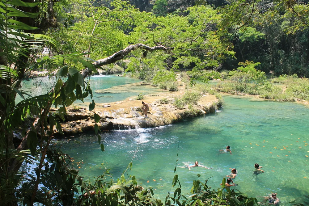 People swimming at Semuc Champey, Guatemala