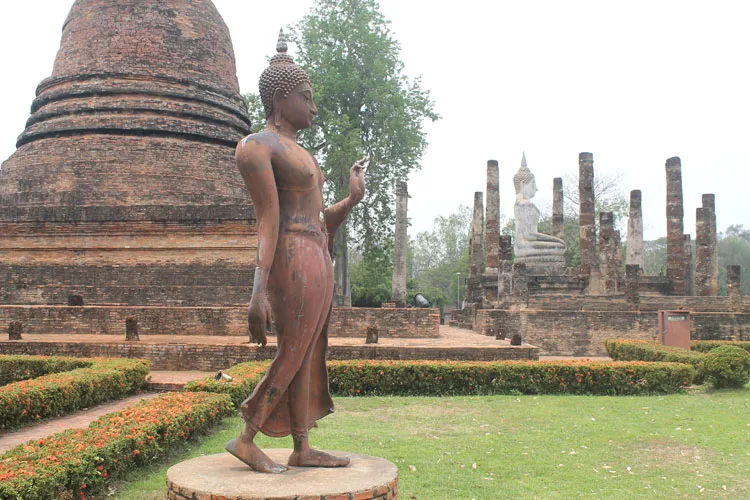Cycling between Ancient Ruins in Sukhothai, Thailand -- Wat Sra Si walking Buddha